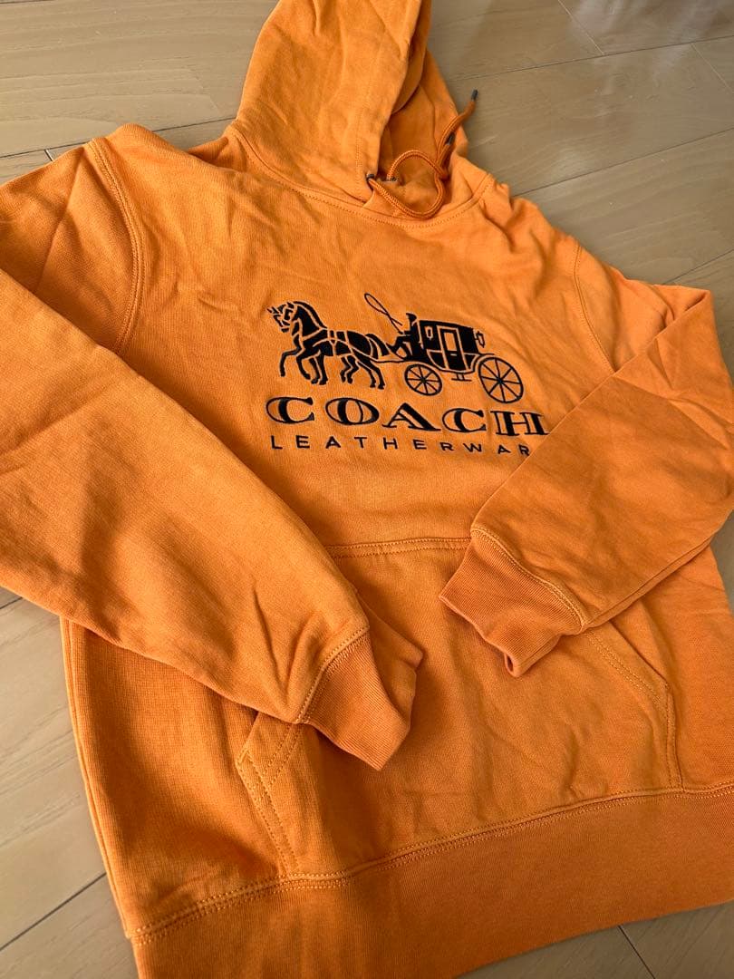 COACH オレンジ パーカー