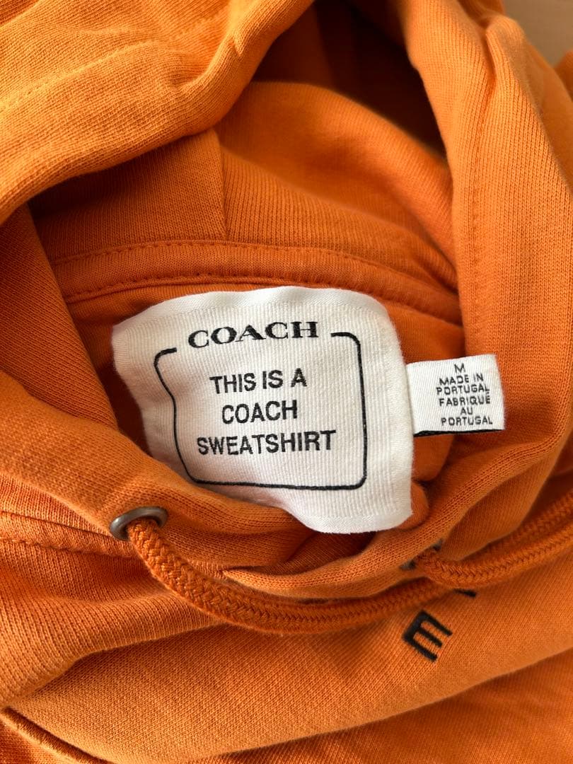 COACH オレンジ パーカー