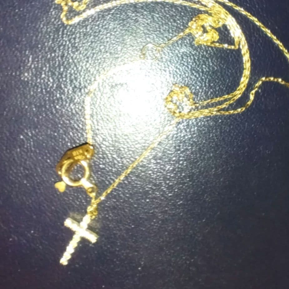 スタージュエリーK18 ダイヤクロスネックレス　マイクロセッティング0.05ct