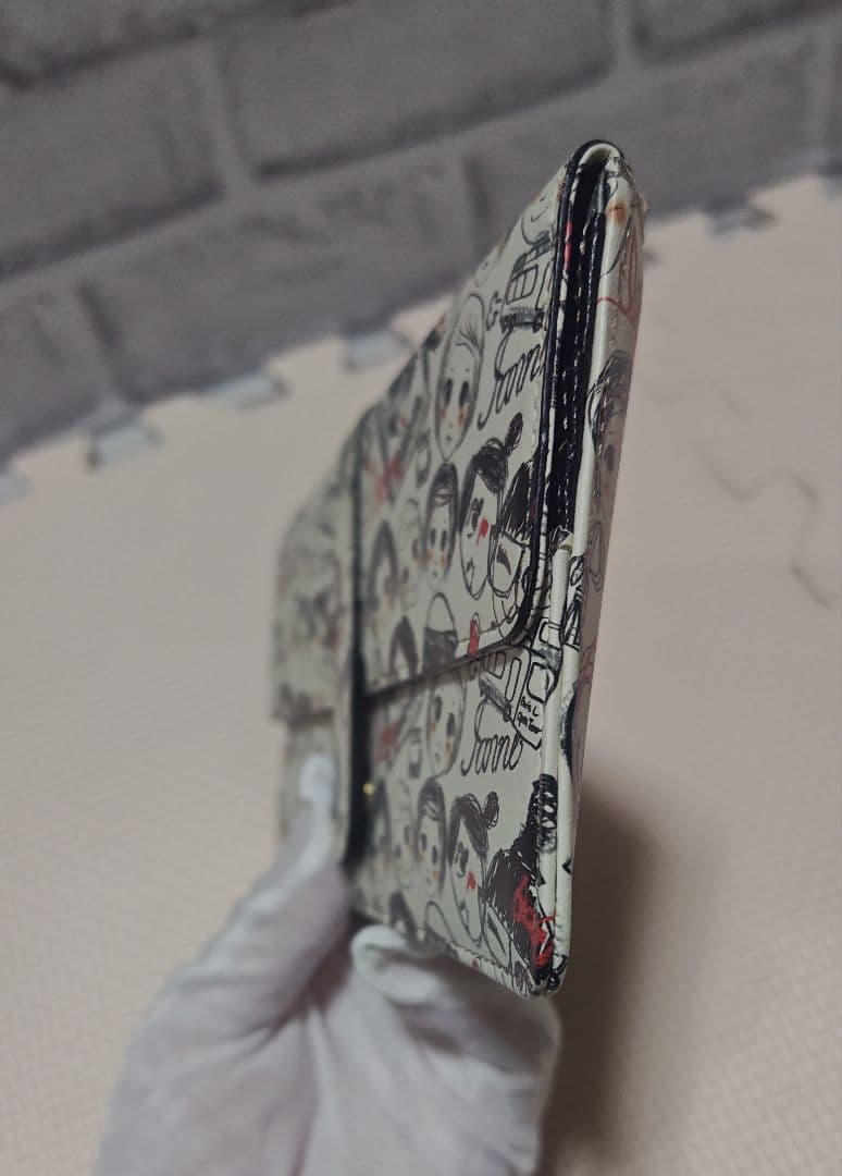 美品・IANNE（イアンヌ）フラグメントケースのような長財布 フェイス柄