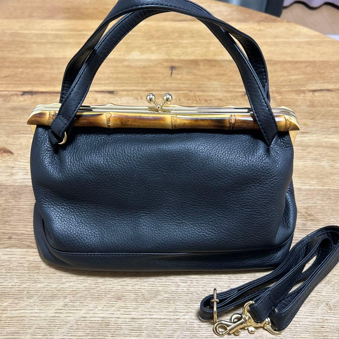 シ*ュ様 新品未使用　POMTATA 牛革　ハンドバッグがま口スコットクラブ系