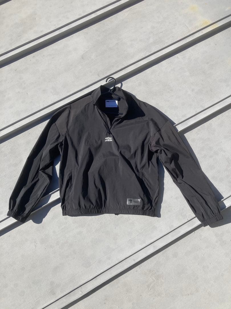 NBB WEEKEND × UMBROハーフジップ ピステ ジャケット