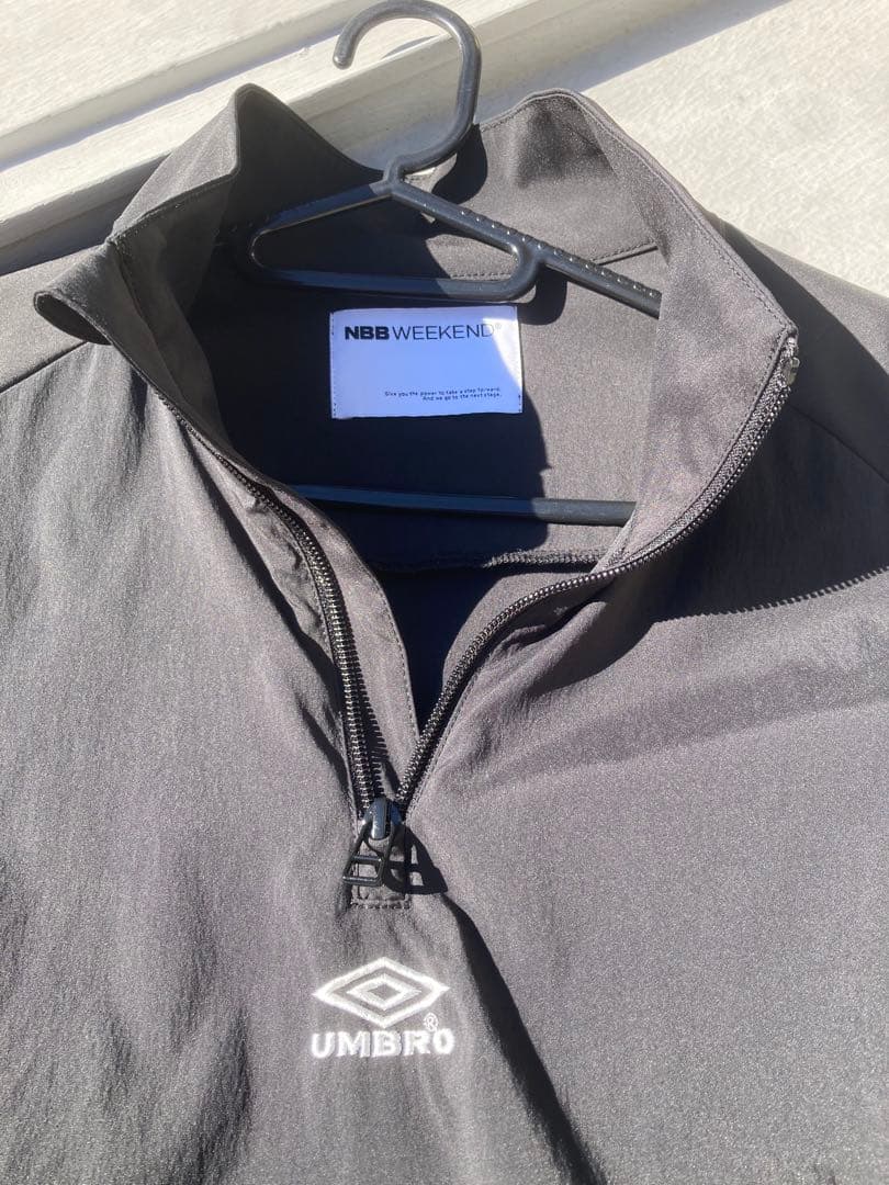 NBB WEEKEND × UMBROハーフジップ ピステ ジャケット
