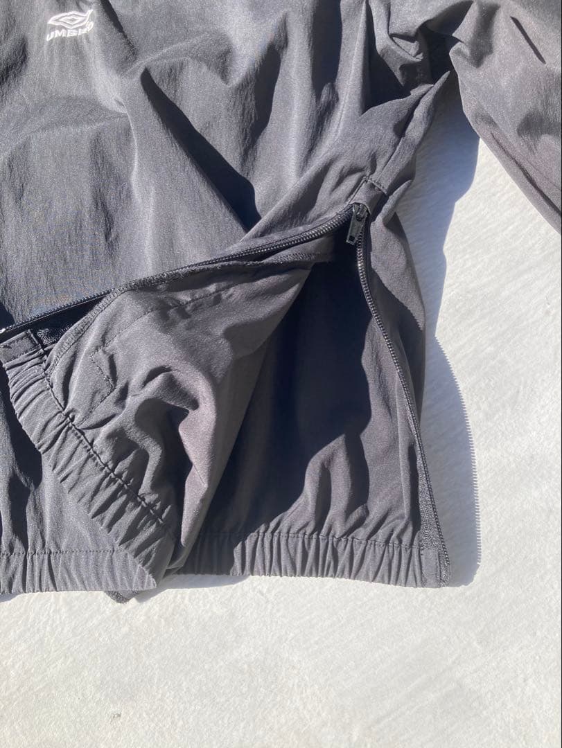 NBB WEEKEND × UMBROハーフジップ ピステ ジャケット