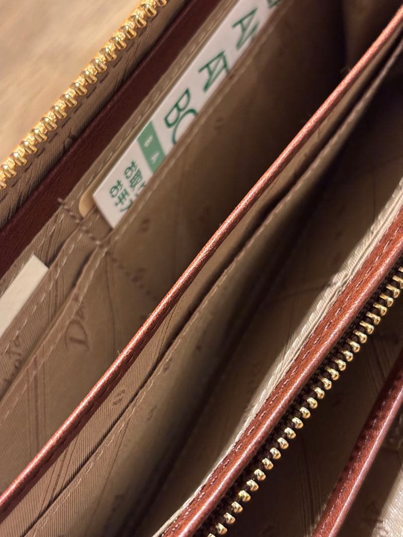 新品 未使用 ダコタ 長財布 ラウンドファスナー オスピタリタ マスタード 黄色