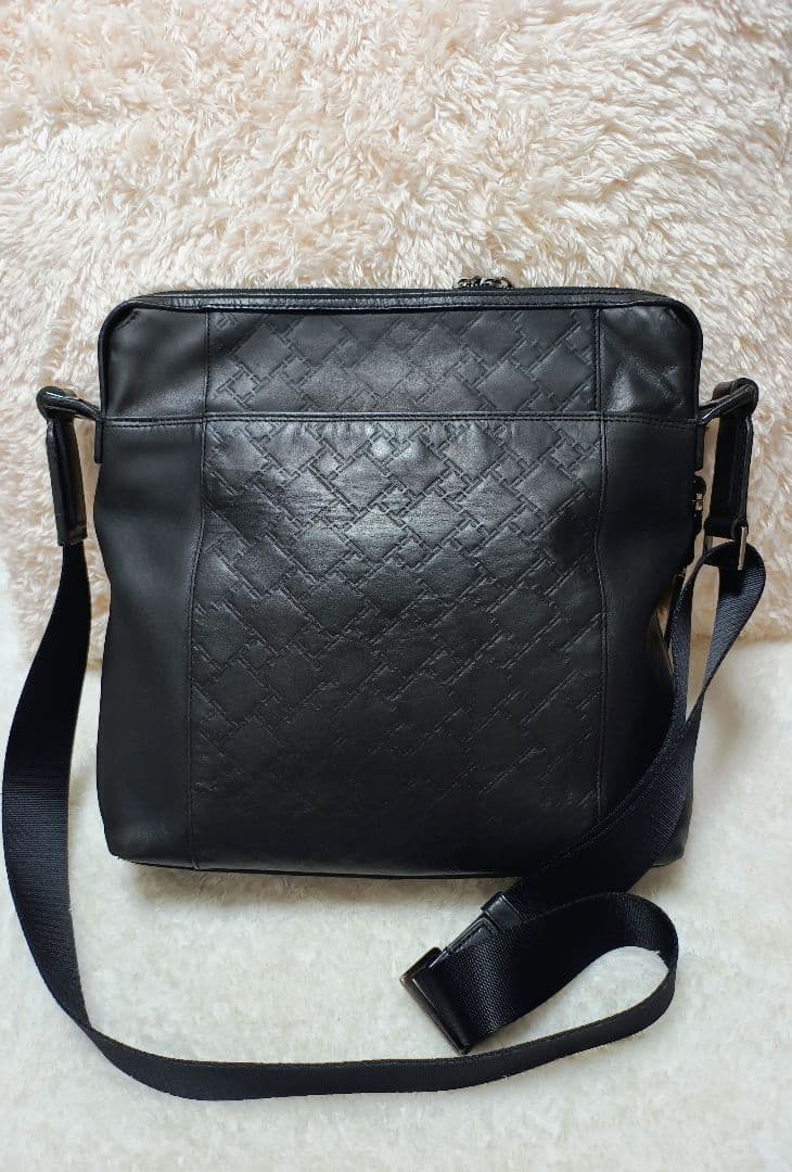 TUMI トゥミ ブラック レザーショルダーバッグ エンボス 型押し