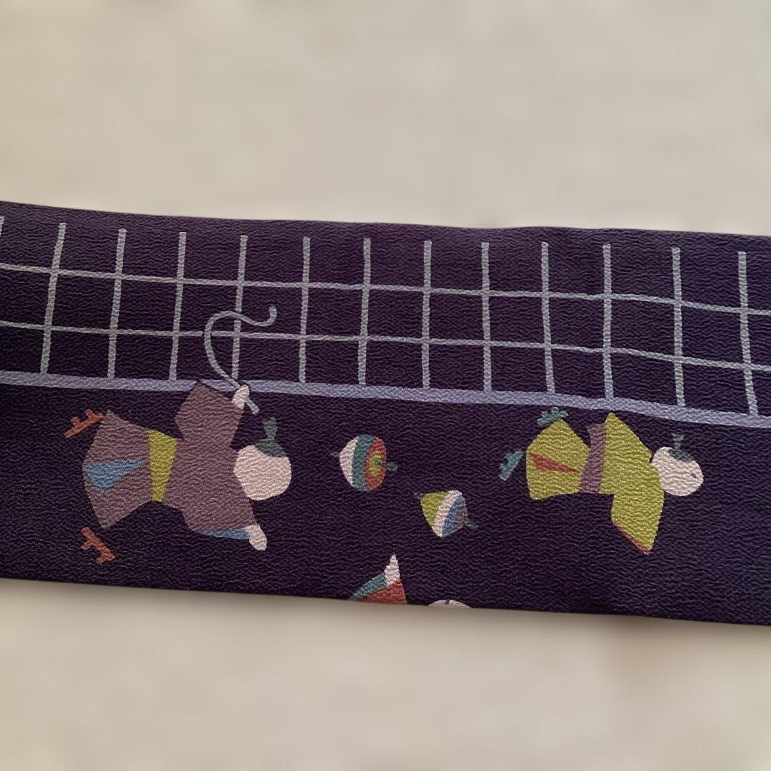 ほぼ未使用品　九寸名古屋帯 全通　正絹縮緬地　濃紫　遊ぶ童子柄　ガード加工済