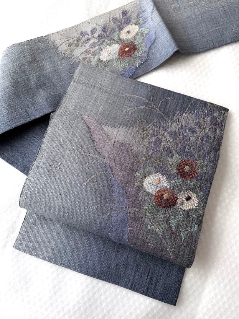 N34 美品 手織り真綿紬 万寿菊模様織出し 正絹 名古屋帯 ブルーグレー 暈し