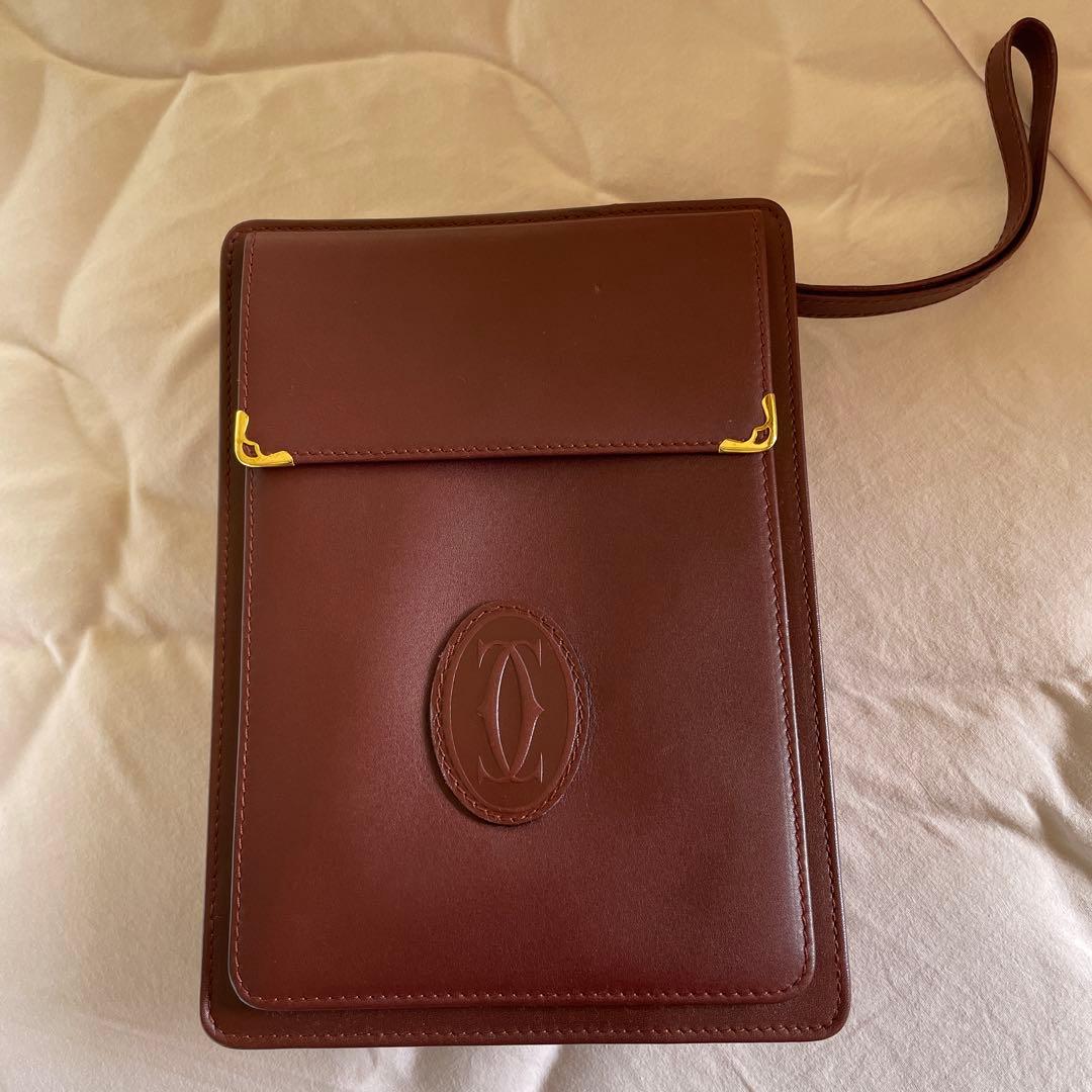 未使用　極美品　カルティエCartier ハンドバッグ　クラッチバッグ　エンジ色