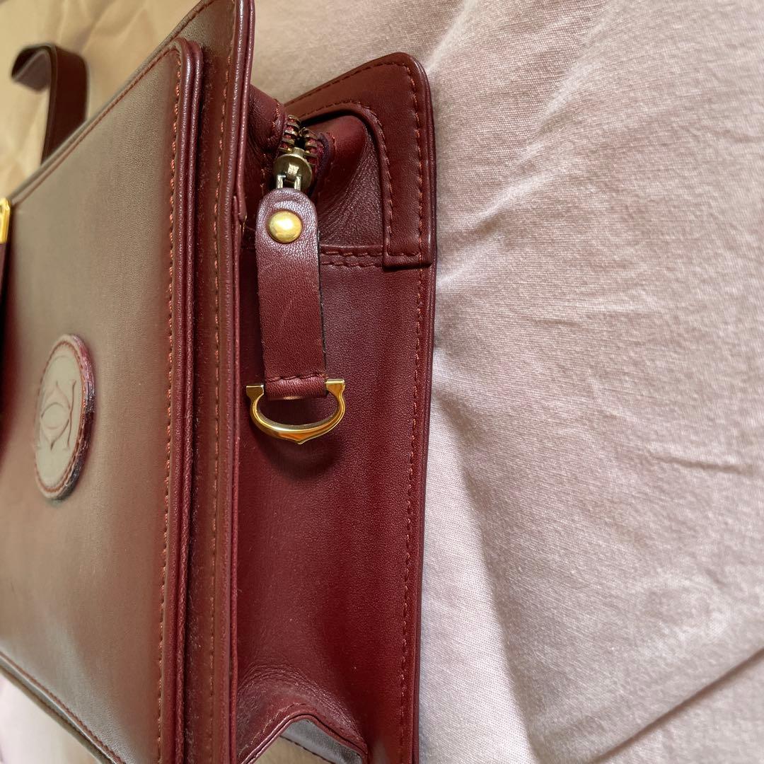 未使用　極美品　カルティエCartier ハンドバッグ　クラッチバッグ　エンジ色