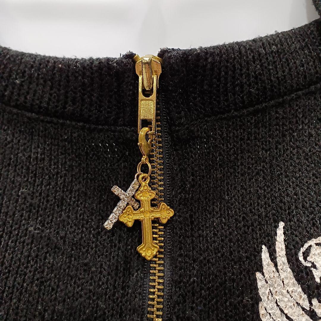 d.i.a. ダイヤ クロス チャーム 金ボタン スカル プリント ロングニット