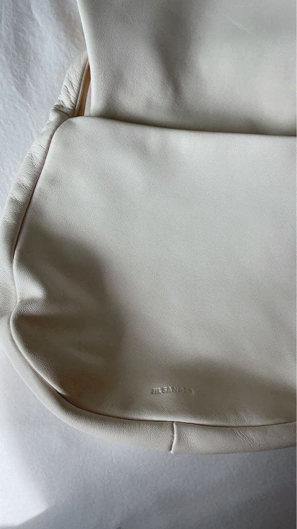 Jil Sander（ジル・サンダー）のホワイトクラッチバッグ /エッグシェル