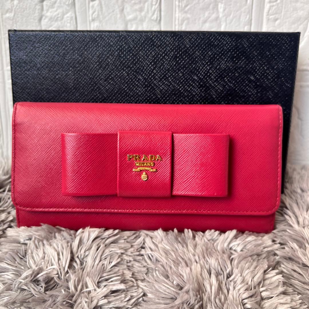 良品✨PRADA フィオッコ　サフィアーノ　メタルロゴ　リボン　ピンク　長財布