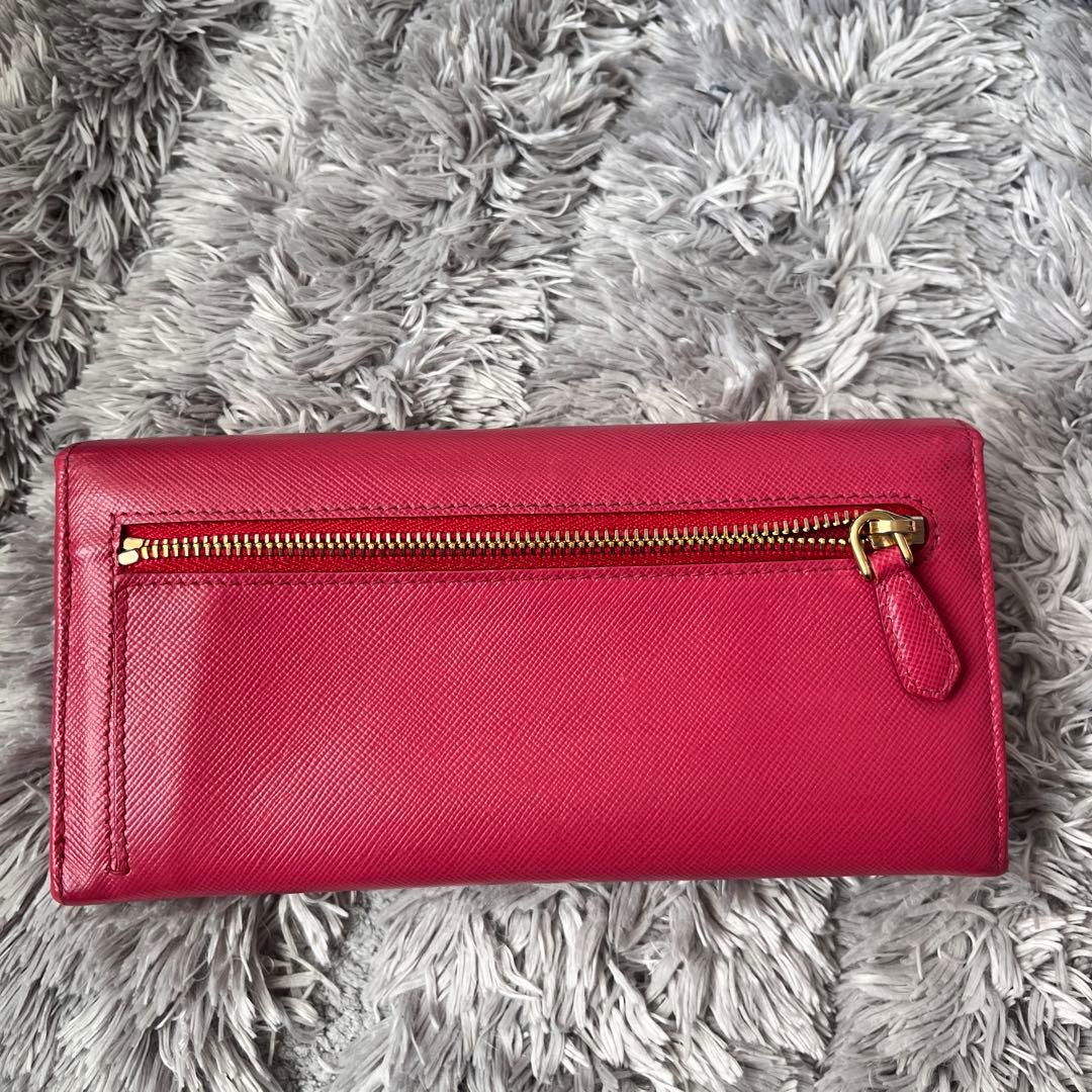 良品✨PRADA フィオッコ　サフィアーノ　メタルロゴ　リボン　ピンク　長財布
