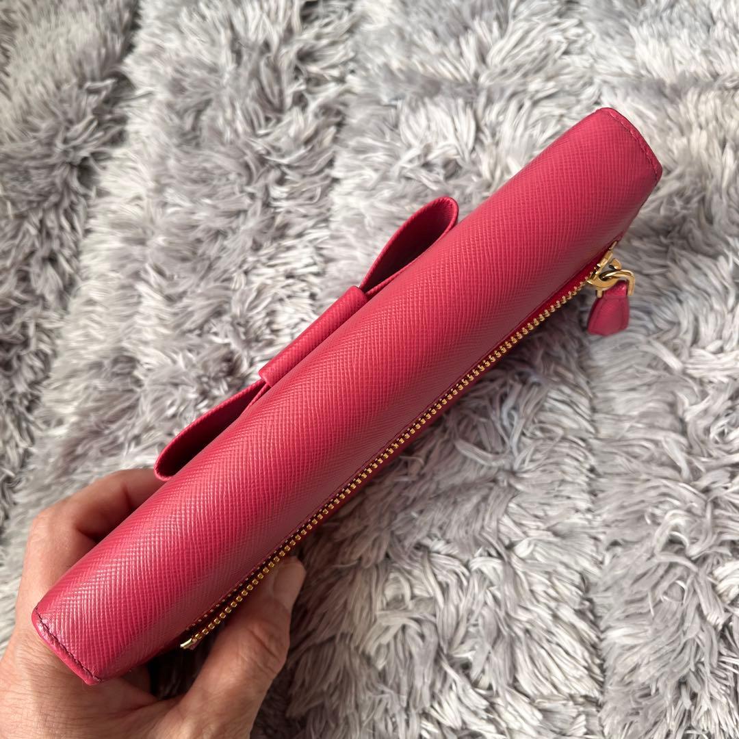 良品✨PRADA フィオッコ　サフィアーノ　メタルロゴ　リボン　ピンク　長財布