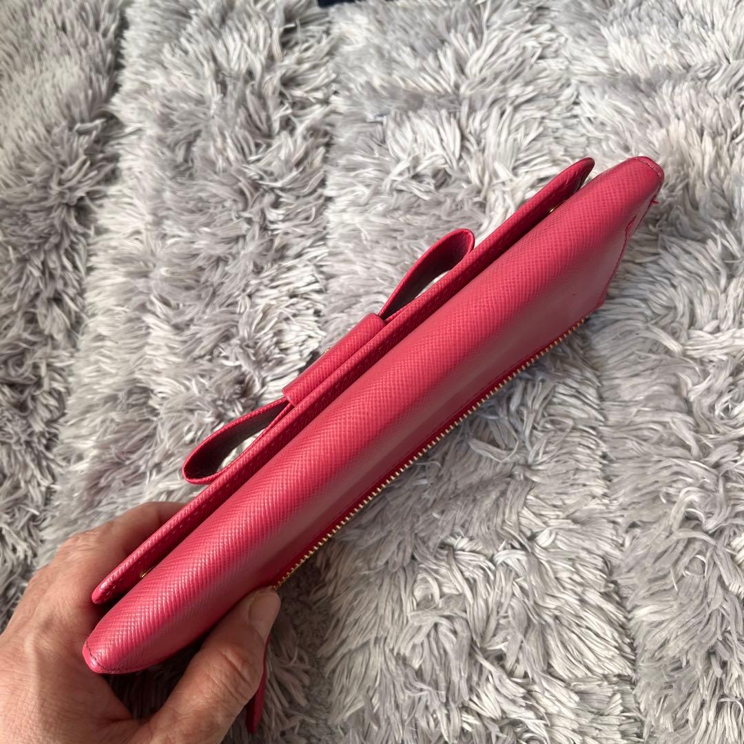 良品✨PRADA フィオッコ　サフィアーノ　メタルロゴ　リボン　ピンク　長財布