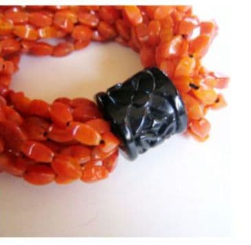 新品未使用　ANGELA CAPUTI の14連のゴムバングル　オレンジ