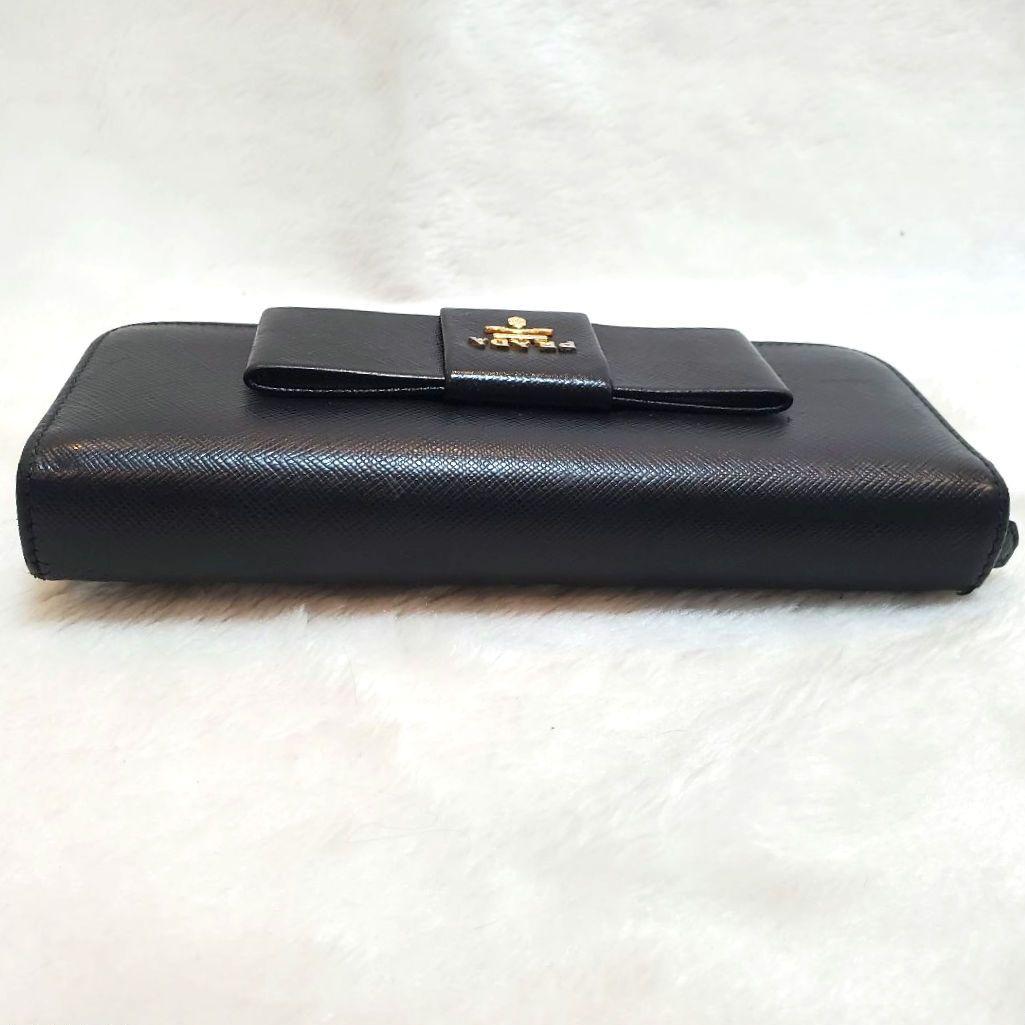 美品 プラダ　長財布 サフィアーノ フィオッコ ライト黒 メタルロゴ リボン