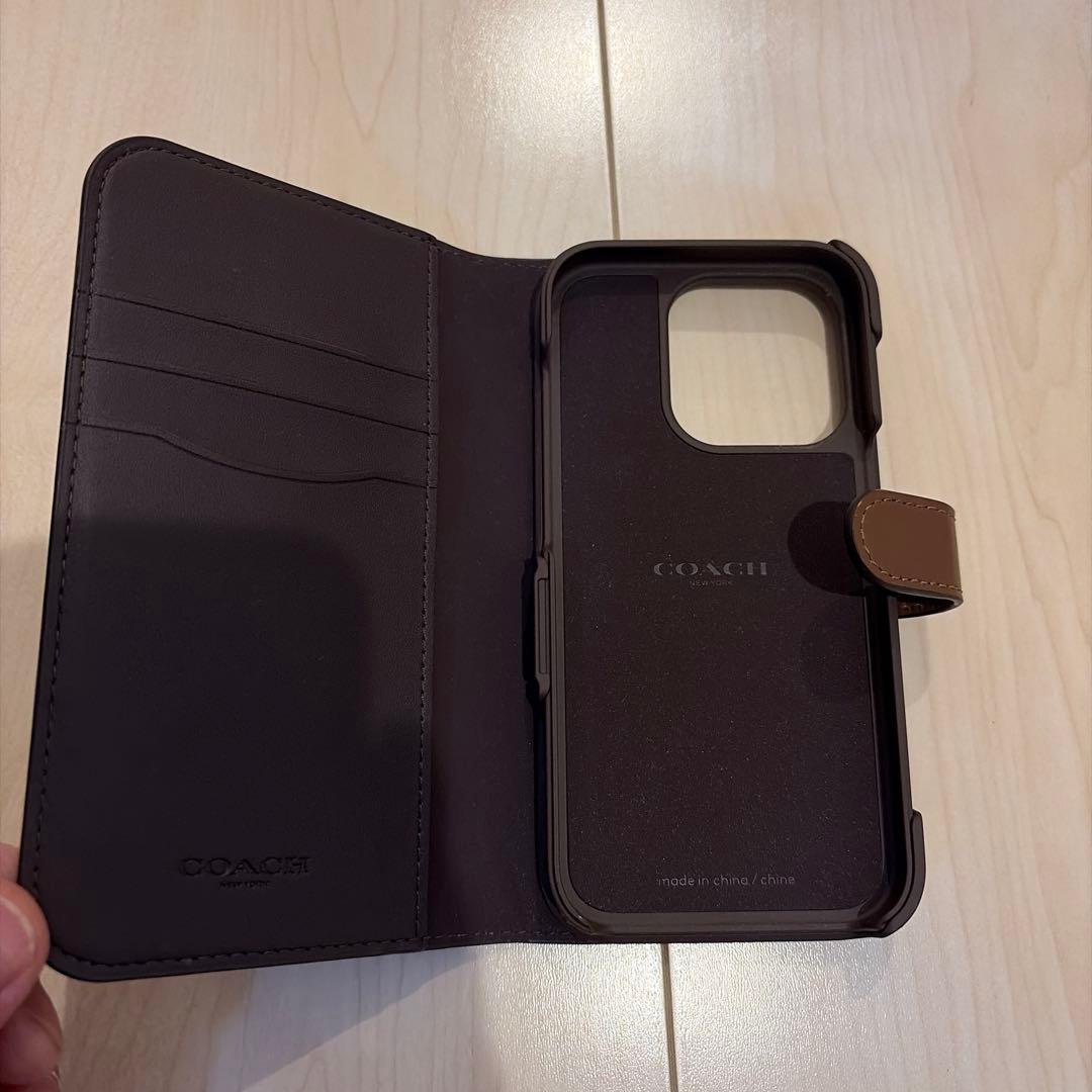 コーチiPhone15 PRO ケース シグネチャー 手帳型 スマホケース 収納