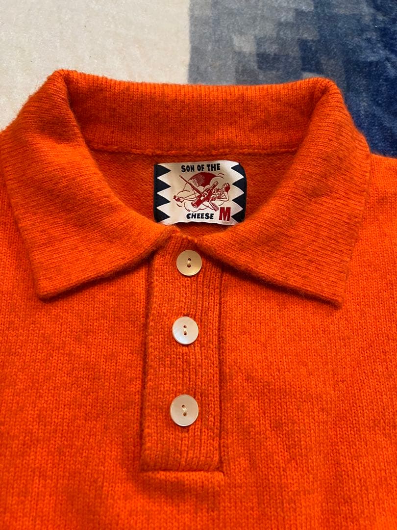 SON OF THE CHEESE オレンジ ポロニット M