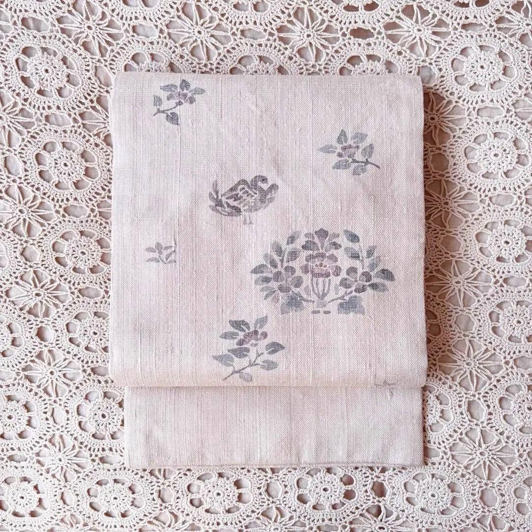 花と鳥の模様 くすんだピンクグレー ピンクベージュ 名古屋帯 紬帯